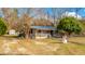 Single story home with covered porch and snowman decoration at 1305 Sandy Run Cir, Summerville, SC 29486