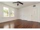 Bright bedroom with polished hardwood floors, white walls, and multiple closets at 1808 Calvert St, North Charleston, SC 29405