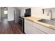 Modern kitchen with stainless steel appliances, butcher block counters, and wood-style flooring at 1808 Calvert St, North Charleston, SC 29405