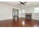 Inviting living room with fireplace, built-in bookshelves, hardwood floors, and arched entryway at 1808 Calvert St, North Charleston, SC 29405