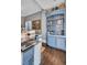 Elegant home bar with blue cabinetry and granite countertop at 208 Sumter Ave, Summerville, SC 29483