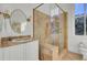 Bright bathroom with walk-in shower, vanity, and marble-look tile at 208 Sumter Ave, Summerville, SC 29483