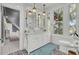 Stylish bathroom, double vanity with marble top, and geometric tile floor at 208 Sumter Ave, Summerville, SC 29483