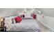 Twin bedroom with gray bedding and red pillows in an attic setting at 208 Sumter Ave, Summerville, SC 29483