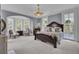 Main bedroom with large windows and ornate bed at 208 Sumter Ave, Summerville, SC 29483