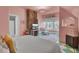 Bright bedroom with a fireplace and charming window views at 208 Sumter Ave, Summerville, SC 29483