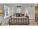 Bedroom with a large bed and bay windows at 208 Sumter Ave, Summerville, SC 29483