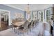 Formal dining room with a large table, chandelier, and hardwood floors at 208 Sumter Ave, Summerville, SC 29483