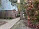Brick pathway leads to a home with a red door, brick steps and lush landscaping at 208 Sumter Ave, Summerville, SC 29483