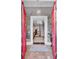 Grand entry with red doors, ornate wallpaper, and chandelier at 208 Sumter Ave, Summerville, SC 29483