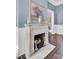 Elegant marble fireplace with ornate mantel and hardwood floors at 208 Sumter Ave, Summerville, SC 29483