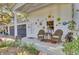 Inviting front porch with wicker chairs and colorful decor at 208 Sumter Ave, Summerville, SC 29483