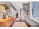Long hallway with grand staircase and patterned wallpaper at 208 Sumter Ave, Summerville, SC 29483