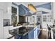 Bright kitchen boasts a large island with a double sink and granite at 208 Sumter Ave, Summerville, SC 29483