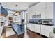 Modern kitchen with white cabinets, blue accents and large island at 208 Sumter Ave, Summerville, SC 29483
