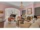Living room boasts a piano and stylish seating at 208 Sumter Ave, Summerville, SC 29483