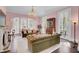 Spacious living room with pink walls, fireplace, and velvet sofas at 208 Sumter Ave, Summerville, SC 29483