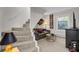 Cozy living area with a sofa and a staircase at 208 Sumter Ave, Summerville, SC 29483