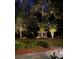 Landscaped backyard at night with a gazebo illuminated by lights at 208 Sumter Ave, Summerville, SC 29483