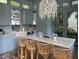 Outdoor kitchen with marble countertops, stainless steel appliances, and island seating at 208 Sumter Ave, Summerville, SC 29483