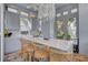 Outdoor kitchen boasts marble countertops, stainless steel appliances, and island seating at 208 Sumter Ave, Summerville, SC 29483