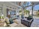 Covered patio with seating area, fire pit, and hanging swing at 208 Sumter Ave, Summerville, SC 29483