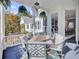 Relaxing outdoor porch with seating area and lush landscaping at 208 Sumter Ave, Summerville, SC 29483