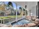 Spacious porch with seating area, overlooking a beautifully landscaped yard at 208 Sumter Ave, Summerville, SC 29483