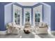 Bright sitting area with bay windows and comfy chairs at 208 Sumter Ave, Summerville, SC 29483