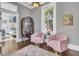 Charming sitting area with pink velvet chairs and a unique cabinet at 208 Sumter Ave, Summerville, SC 29483
