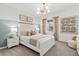 Bright bedroom with white bed frame and neutral decor at 209 West Bradford Pointe Dr, Summerville, SC 29486