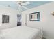 Bright bedroom with white bed, light blue ceiling, and view to another room at 229 Plymouth Ave # 1, Charleston, SC 29412