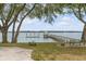 Tranquil waterfront view with private dock and gazebo, perfect for relaxation at 2432 Hanscombe Point Rd, Johns Island, SC 29455