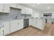 Modern white kitchen with stainless steel appliances and quartz countertops at 2462 Swallow Dr, Charleston, SC 29414