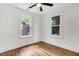 Bright bedroom with multiple windows and polished wood floors at 2712 E Surrey Dr, North Charleston, SC 29405