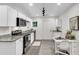 Modern kitchen with white cabinets, stainless steel appliances, and granite countertops at 2712 E Surrey Dr, North Charleston, SC 29405