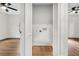 Laundry room with louvered doors and hardwood floors at 2712 E Surrey Dr, North Charleston, SC 29405