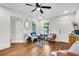 Cozy living room with wood floors, ceiling fan, and ample natural light at 2712 E Surrey Dr, North Charleston, SC 29405