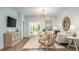 Coastal-styled living room with comfy seating and hardwood floors at 302 Tiliwa St, Summerville, SC 29486