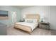 Main bedroom with a large bed, neutral color palette, and plenty of light at 302 Tiliwa St, Summerville, SC 29486