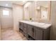 Double vanity bathroom with gray cabinets and a walk-in shower at 305 Cheyenne Rd, Summerville, SC 29483