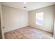 Bright bedroom with wood-look flooring and large window at 305 Cheyenne Rd, Summerville, SC 29483