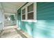 Front porch with white columns and teal siding at 310 Parish Farms Dr, Summerville, SC 29486