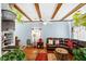 Relaxing living room with leather sectional sofa and exposed wooden beams at 312 4Th Ave, Mount Pleasant, SC 29464