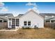 White house with backyard patio, screened porch, and hammock at 356 Garden Lily Ln, Summerville, SC 29485