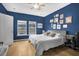 Bedroom with a king-size bed and gallery wall at 356 Garden Lily Ln, Summerville, SC 29485