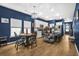 Kitchen and dining area with blue walls and hardwood floors at 356 Garden Lily Ln, Summerville, SC 29485