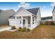 One-story house with a front porch and attached garage at 356 Garden Lily Ln, Summerville, SC 29485