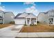 One-story house with a front porch and attached garage at 356 Garden Lily Ln, Summerville, SC 29485