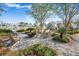 Community fire pit with seating surrounded by landscaping at 356 Garden Lily Ln, Summerville, SC 29485